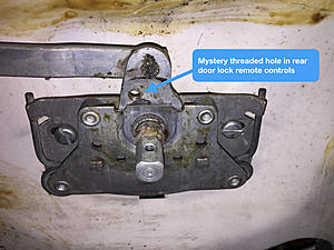 Mystery Thread hole in Rear Door Lock Remote Control-door-lock-remote-control-mystery-threaded-hole.001.jpeg