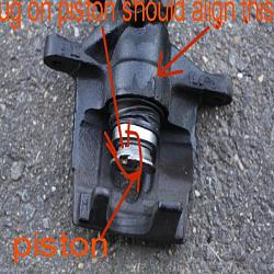 my .rtf doc detailing changing rear pads with pics-beware-orientation-piston.jpg