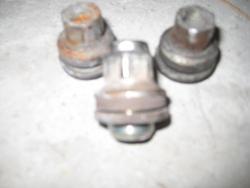 I cannot remove lug nuts. They turn but stay in place.-lug-nuts.jpg