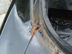 Ugh, water in the trunk when I went to clean it today.  Think it is the r. window sea-dscf3816-medium-.jpg