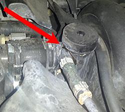 How do I fix a leaking thermostat-housing? (see photo)-20131027_010857.jpg