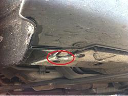 White liquid dripping from driver side wheel arch-jag2.jpg