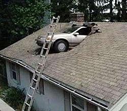 Spring is in the air-car-crashes-into-house-roof.jpg
