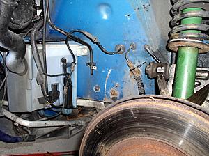97 XK8 Convertible windshield washer reservoir leaking-14-ns-upper-wishbone-abs-wheel-sensor-cable-moved.jpg