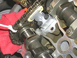 experience &amp; pics of replacing the upper cam chain tensioners(2-post with PICS)How To-left-bank-new-metal-tensioner-rear-view.jpg