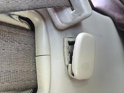 Mystery part below seat belt in rear side panel-image.jpg